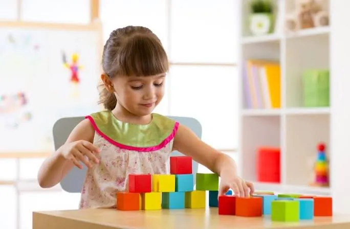 Brand owner showcasing building block set at trade show