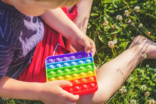 Retail shelf display of custom sensory fidget toy sets