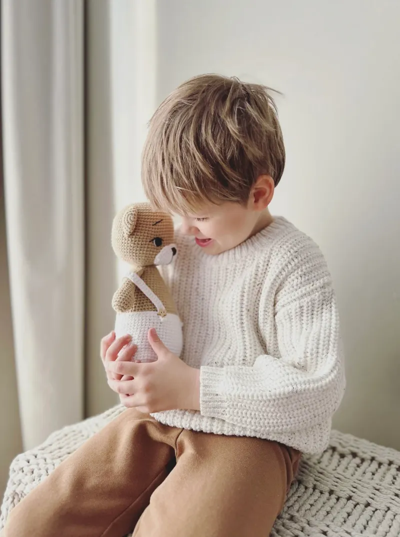 Knitted nursery mobile and decor pieces in a child's room by LeelineToys