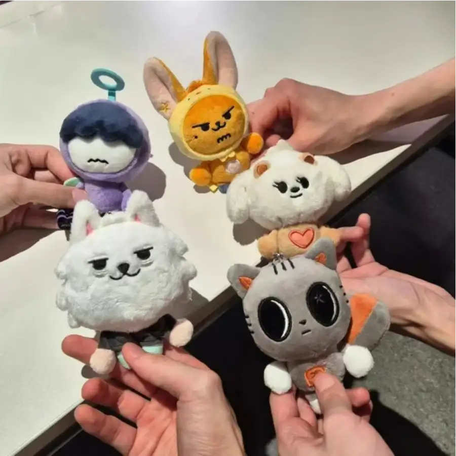 Client holding custom plush keychain — branded promotional keychains