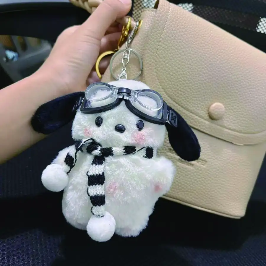 Client with custom logo plush keychain on backpack