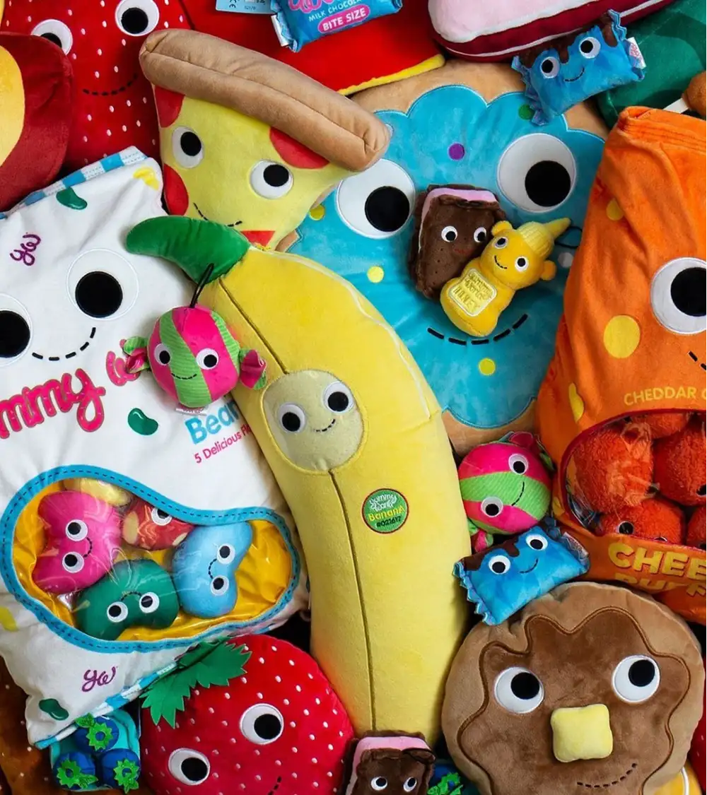 Custom plush toy with detailed embroidered face and accessories