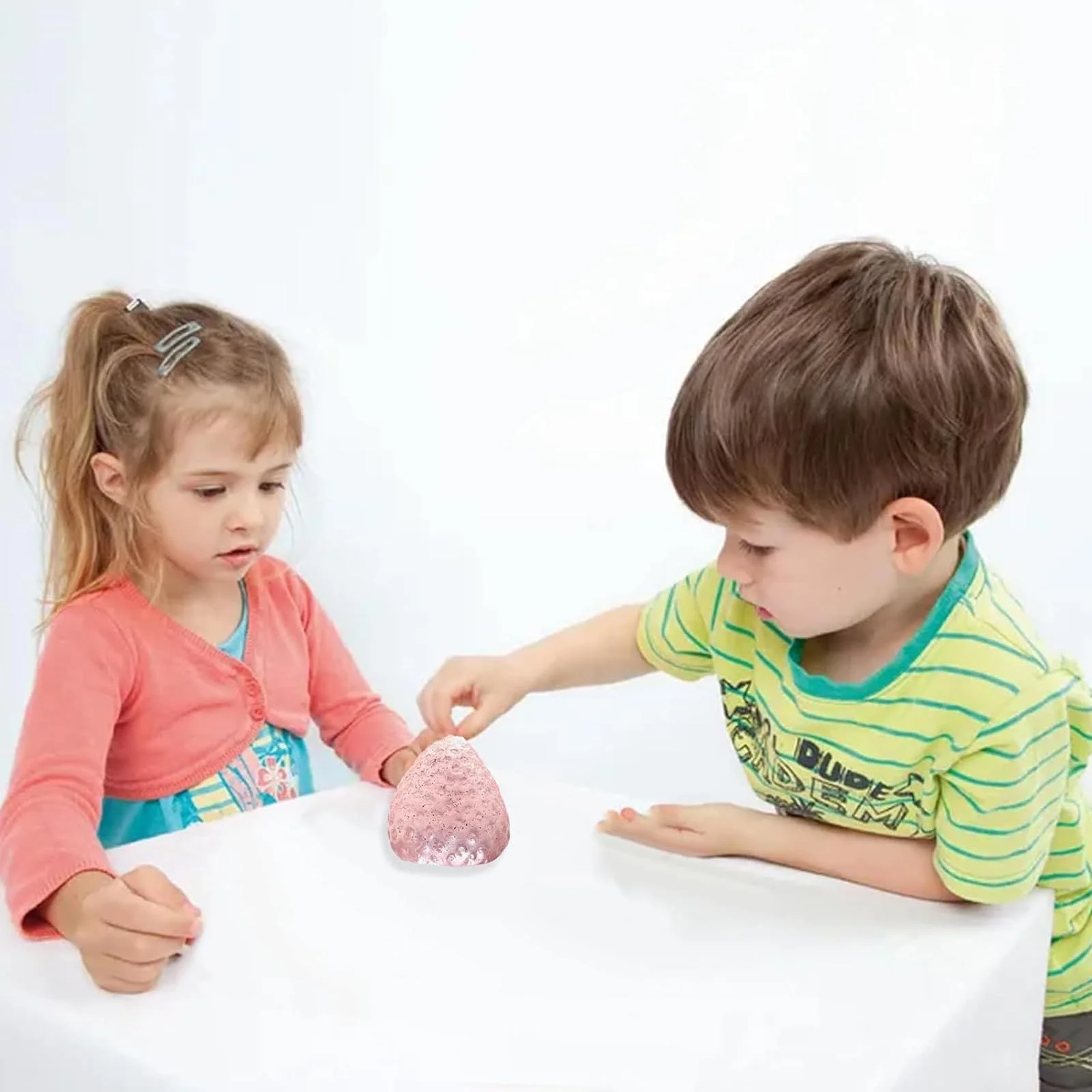 Attendee squeezing custom stress toy at booth