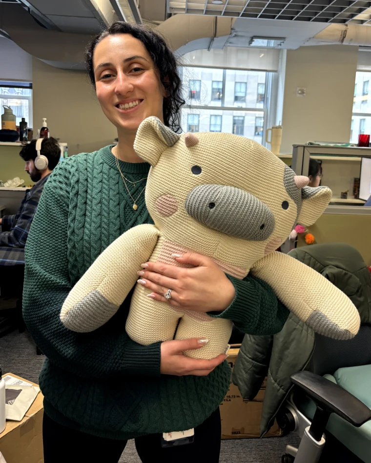 Client holding custom weighted stuffed animal