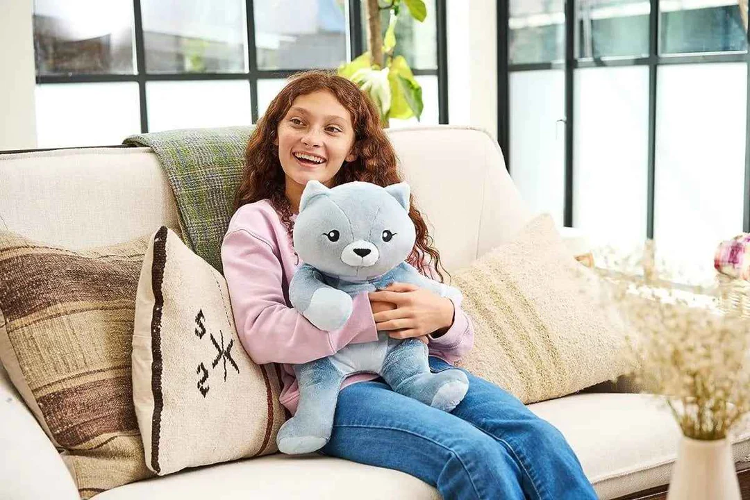 Client holding custom weighted stuffed animal