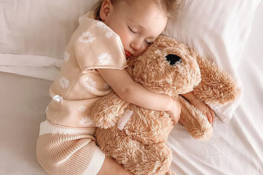 Client holding custom weighted stuffed animal