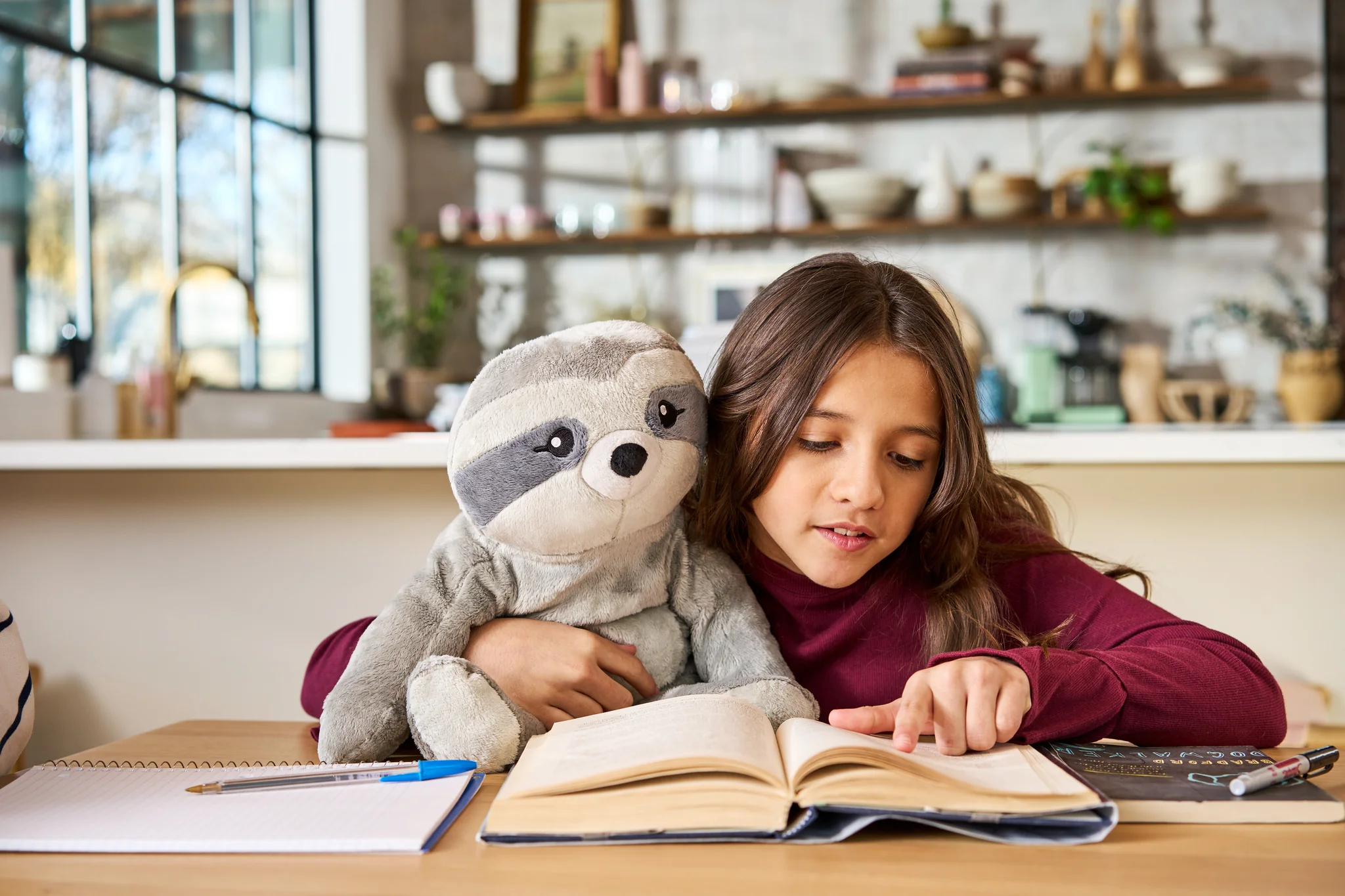 Client holding custom weighted stuffed animal