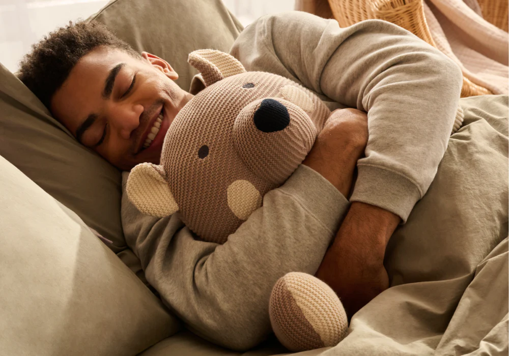 Client holding custom weighted stuffed animal