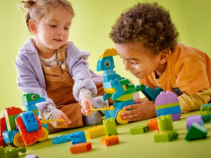 Children playing with custom wooden learning toys