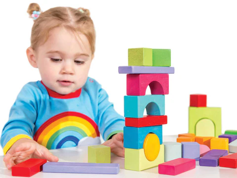 Occupational therapist using custom sensory tools with young patient